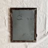 Vintage wall mirror in varnished steel decorated with a rose in relief