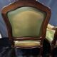 Paire de larges fauteuils XIXe en cuir vert de style Louis XV