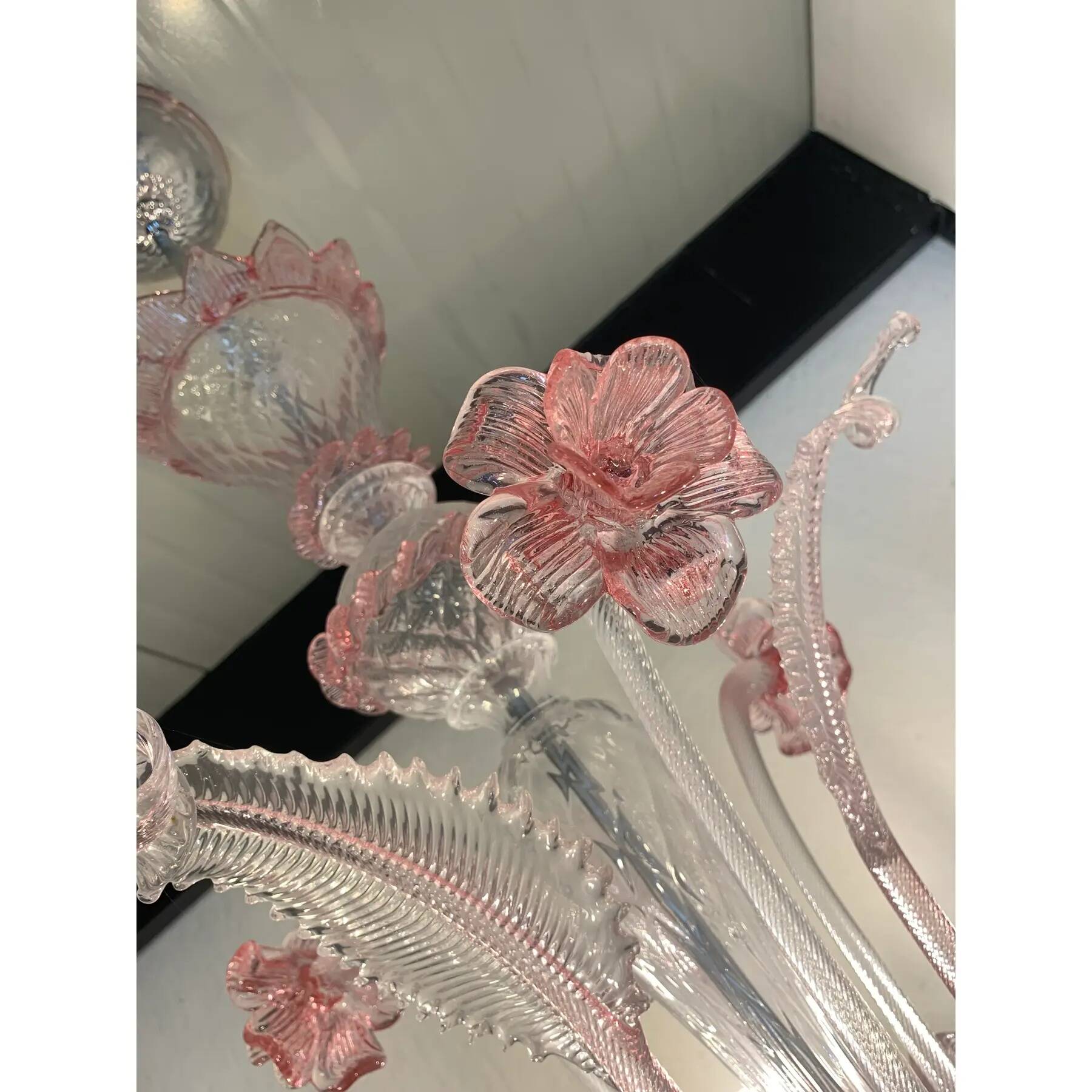 Chandelier in transparent and pink Murano-style glass with flower and leaf.