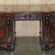 Partner desk with two carved columns featuring lion heads, according to Thomas Chippendale, restored.