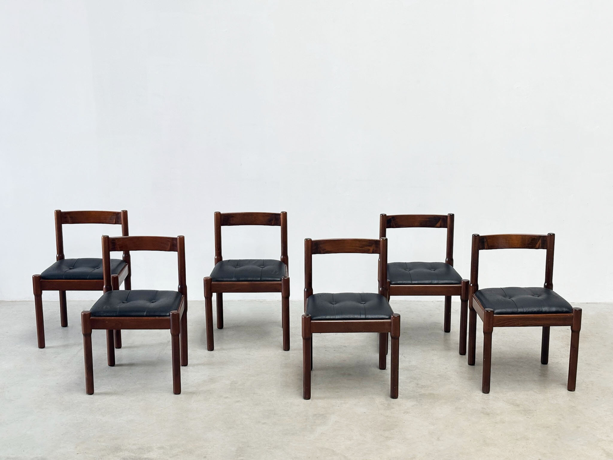 Set of six leather "Carimate" dining chairs by Vico Magistretti for Cassina