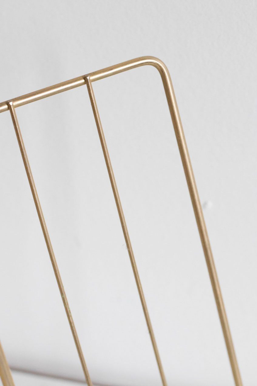 Vintage magazine holder in gold metal