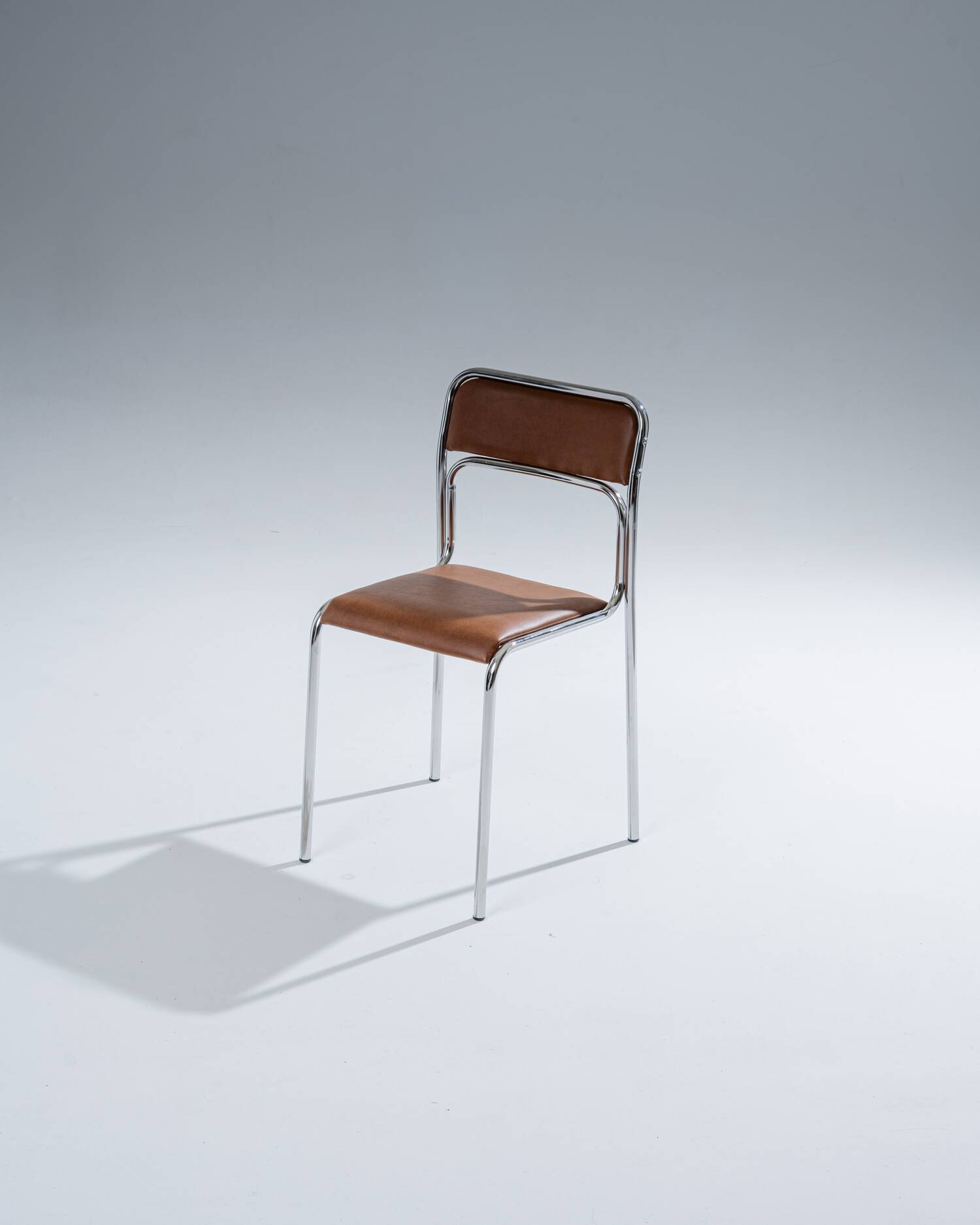 Tubular steel and cognac leatherette chair, 1980s