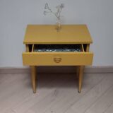 Old bedside table with compass feet
