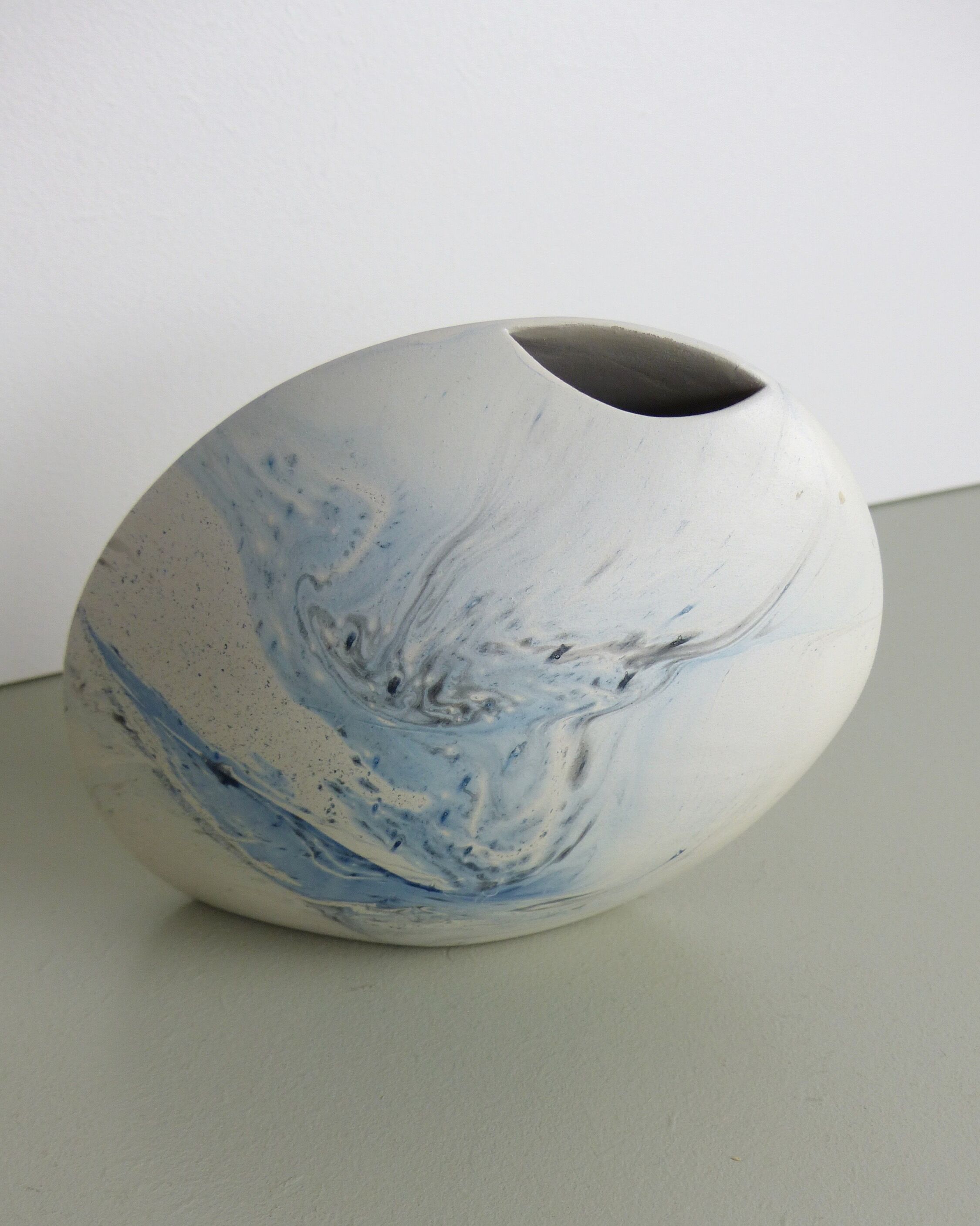 White and blue oval vase
