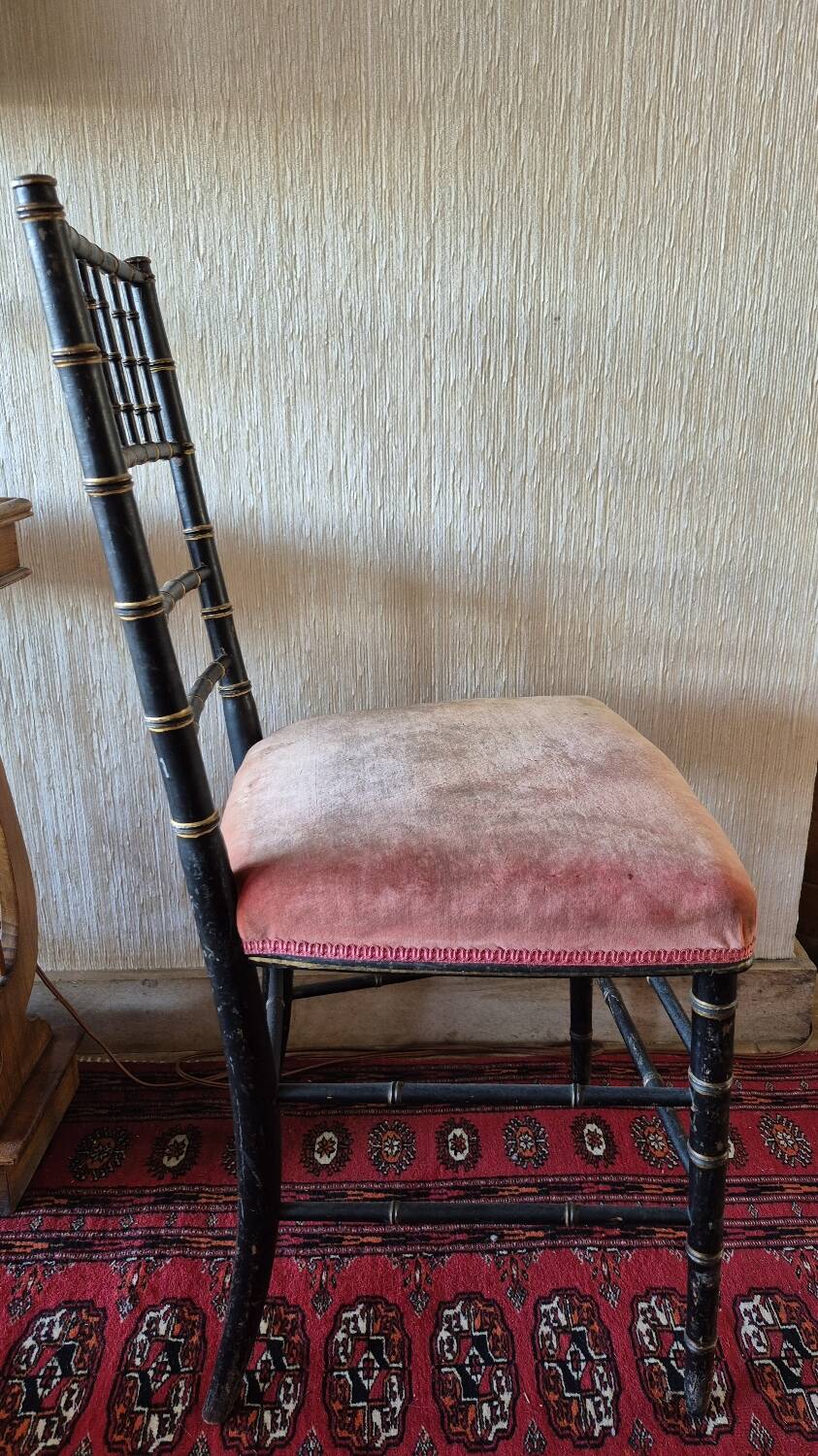 Small Napoléon III chair in black bamboo with a red velvet seat.