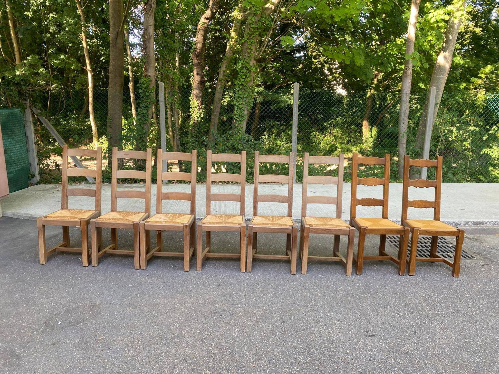8 wooden dining chairs with straw seats, farmhouse style, high back.