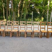 8 wooden dining chairs with straw seats, farmhouse style, high back.