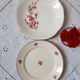 Flat antique earthenware plates with gilded edges