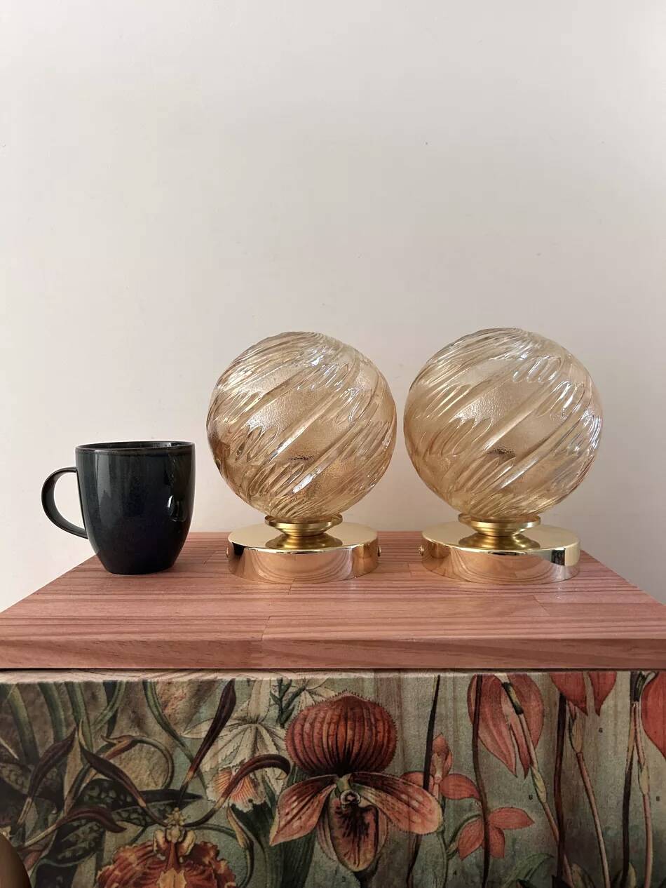 Pair of golden globe wall lights