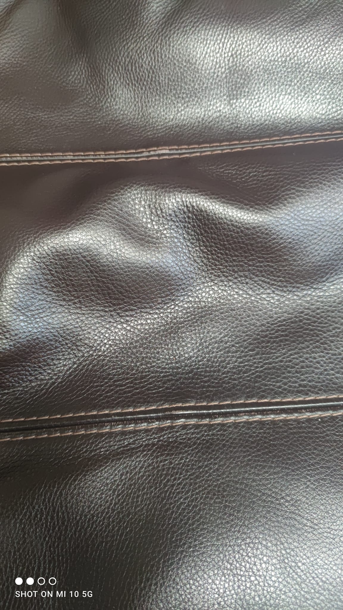 Dark brown leather armchair by Steiner, designed by Pascal Daveluy, Ranelagh model