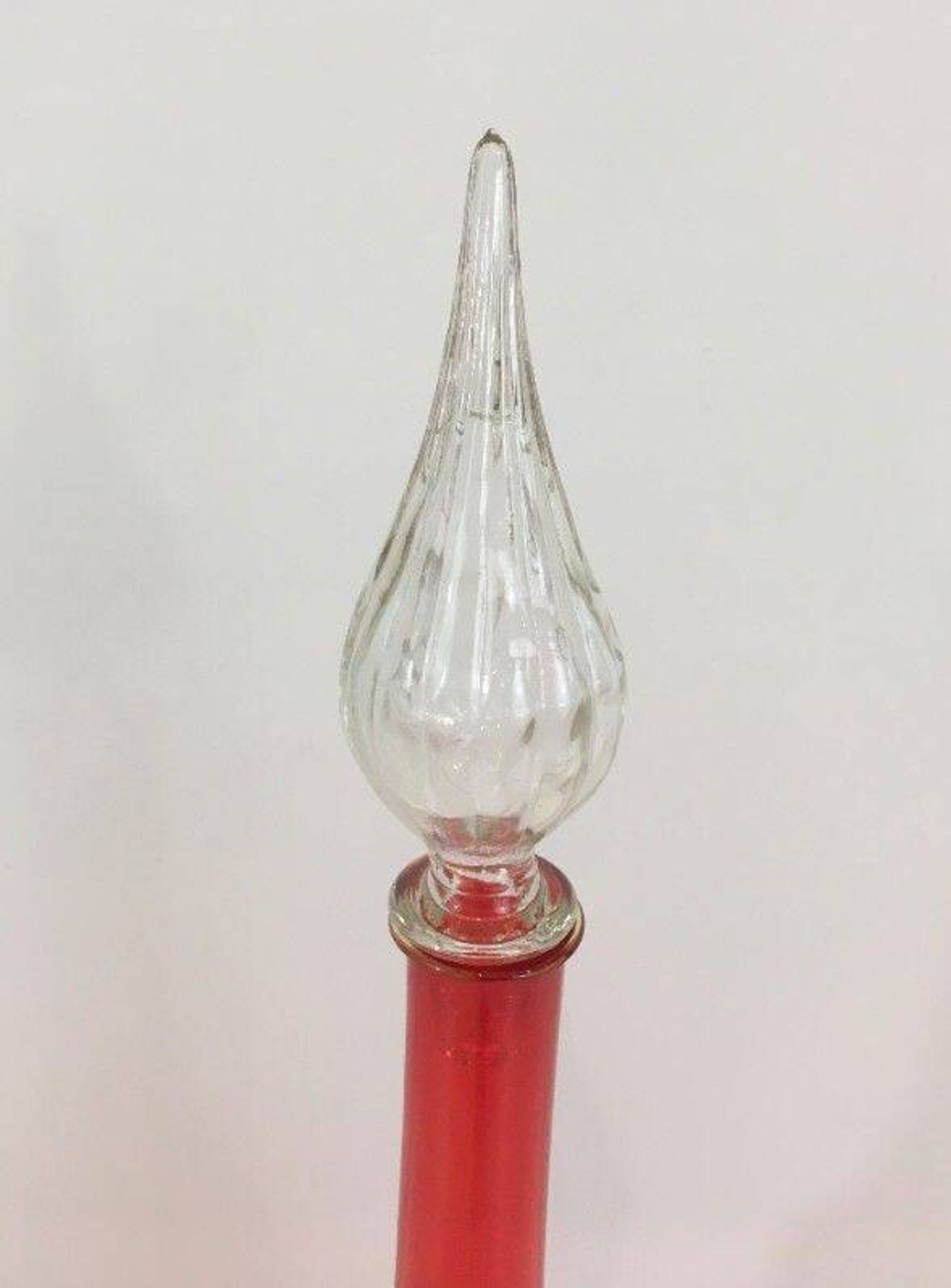 Large designer bottle in red glass