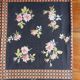 Black tablecloth with bouquets of roses