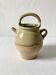 Old small goat-shaped jug in ochre glazed stoneware.