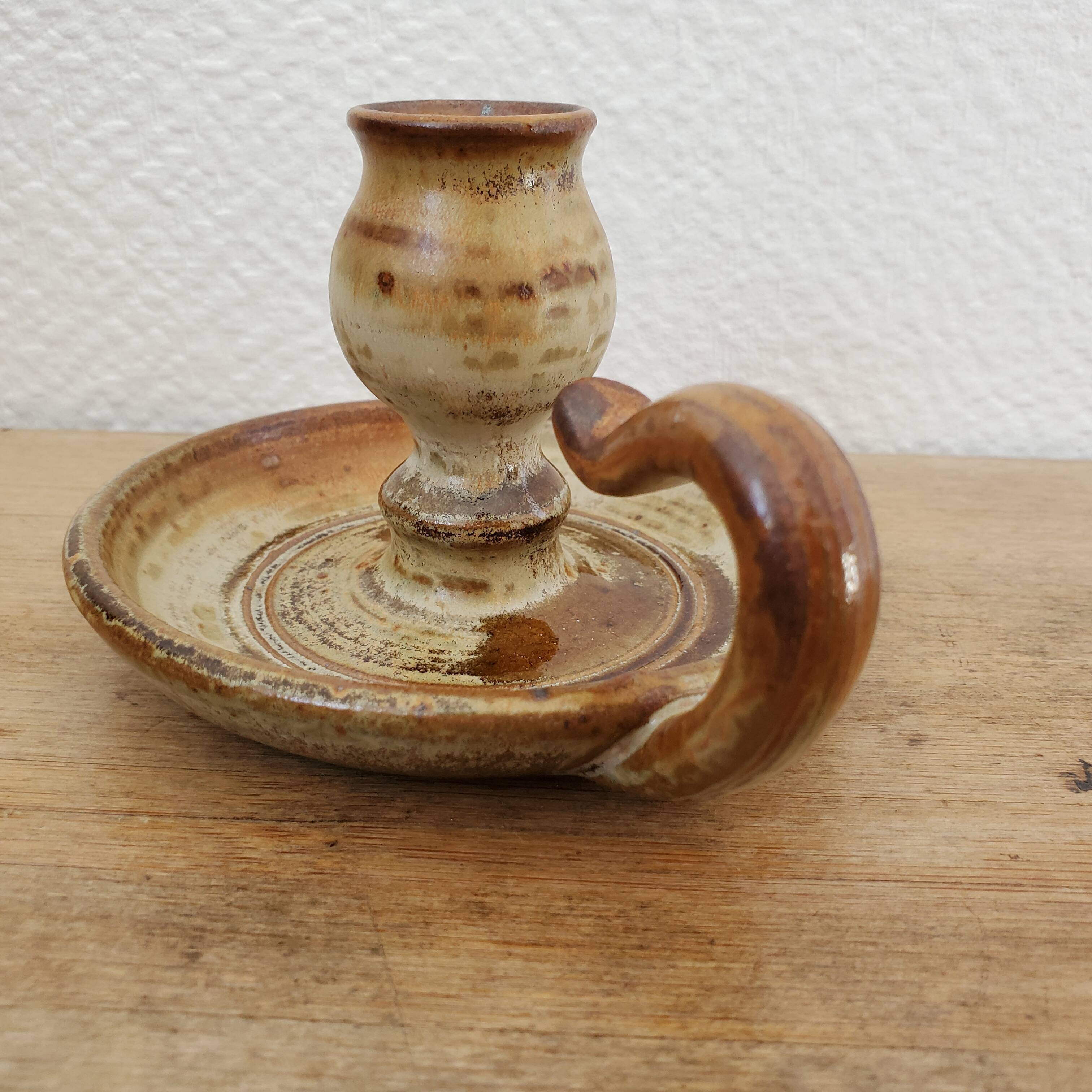 Sandstone candle holder called cellar rat