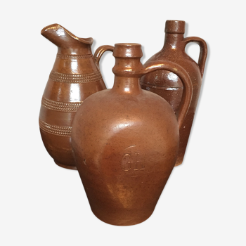 Lot of three bottles or pitchers in glazed sandstone