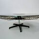 Italian rotating glass and metal coffee table designed for Prada, 1990s.