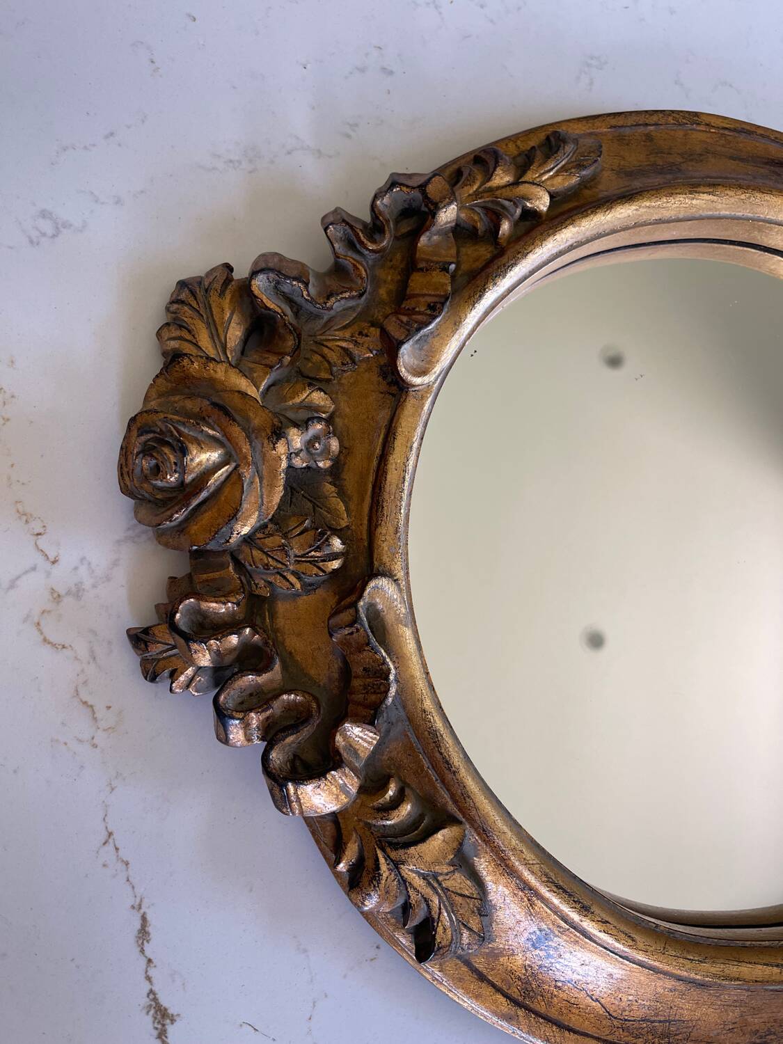 Round carved wooden mirror