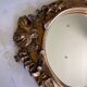 Round carved wooden mirror