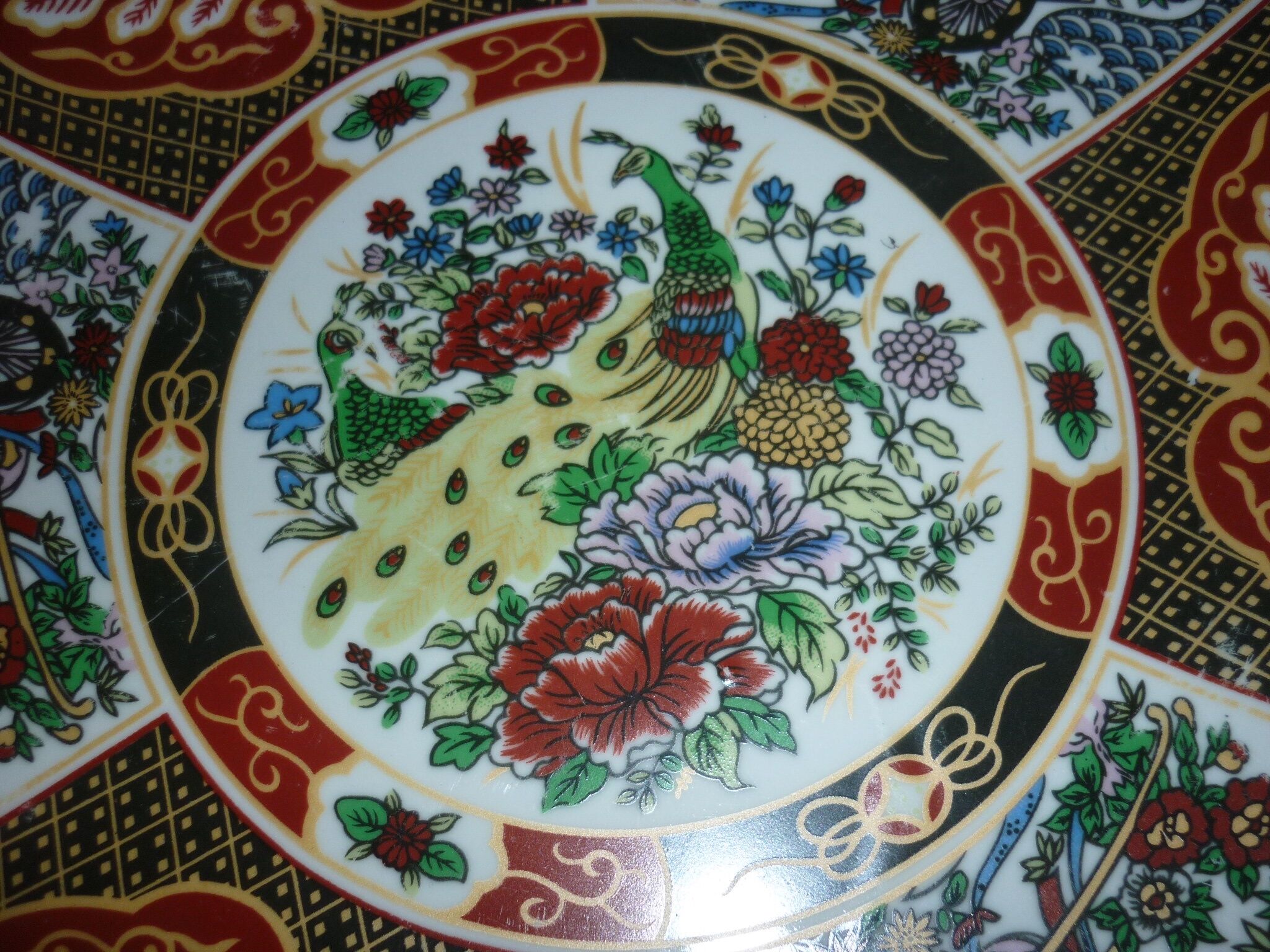 Chinese dish decorated with peacocks and plants