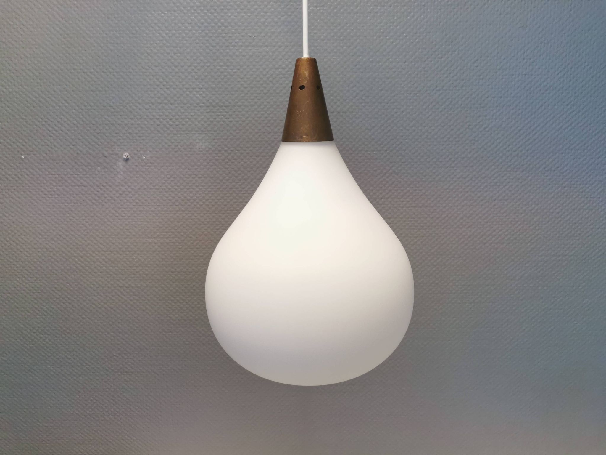 Large hanging lamp in white opal glass with brass top. Danish and estimated from the 1970s.