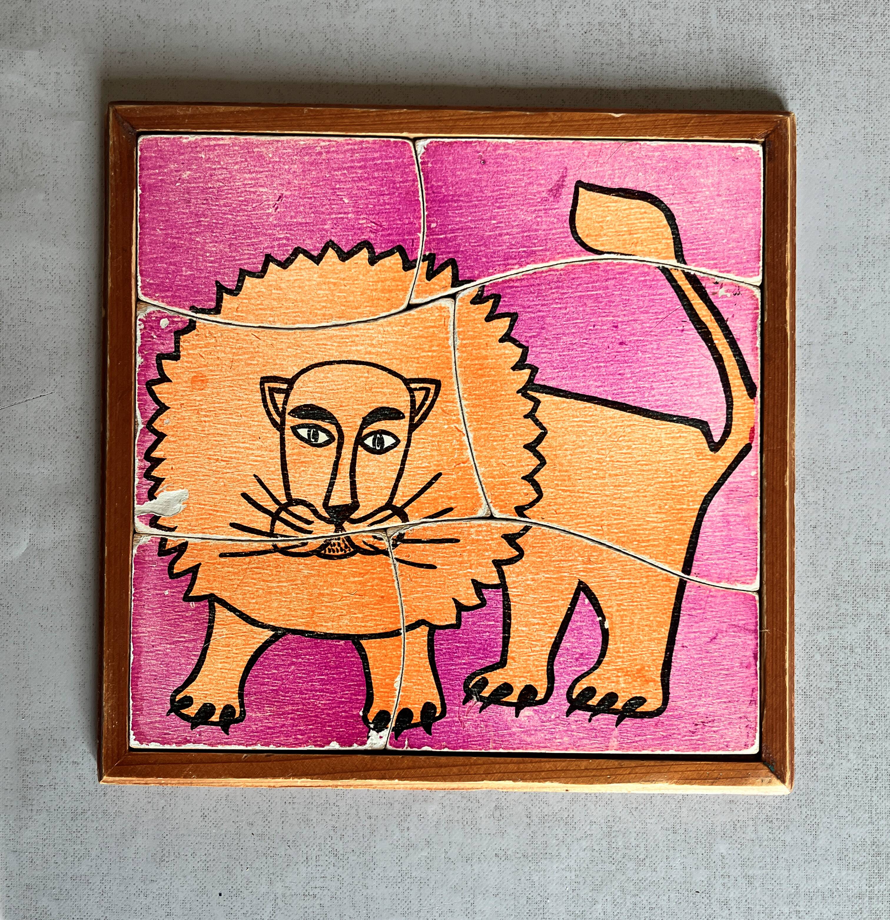 Wooden frame puzzle from the 1960s depicting a lion.