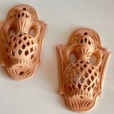 Pair of terracotta wall candle holders