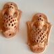 Pair of terracotta wall candle holders