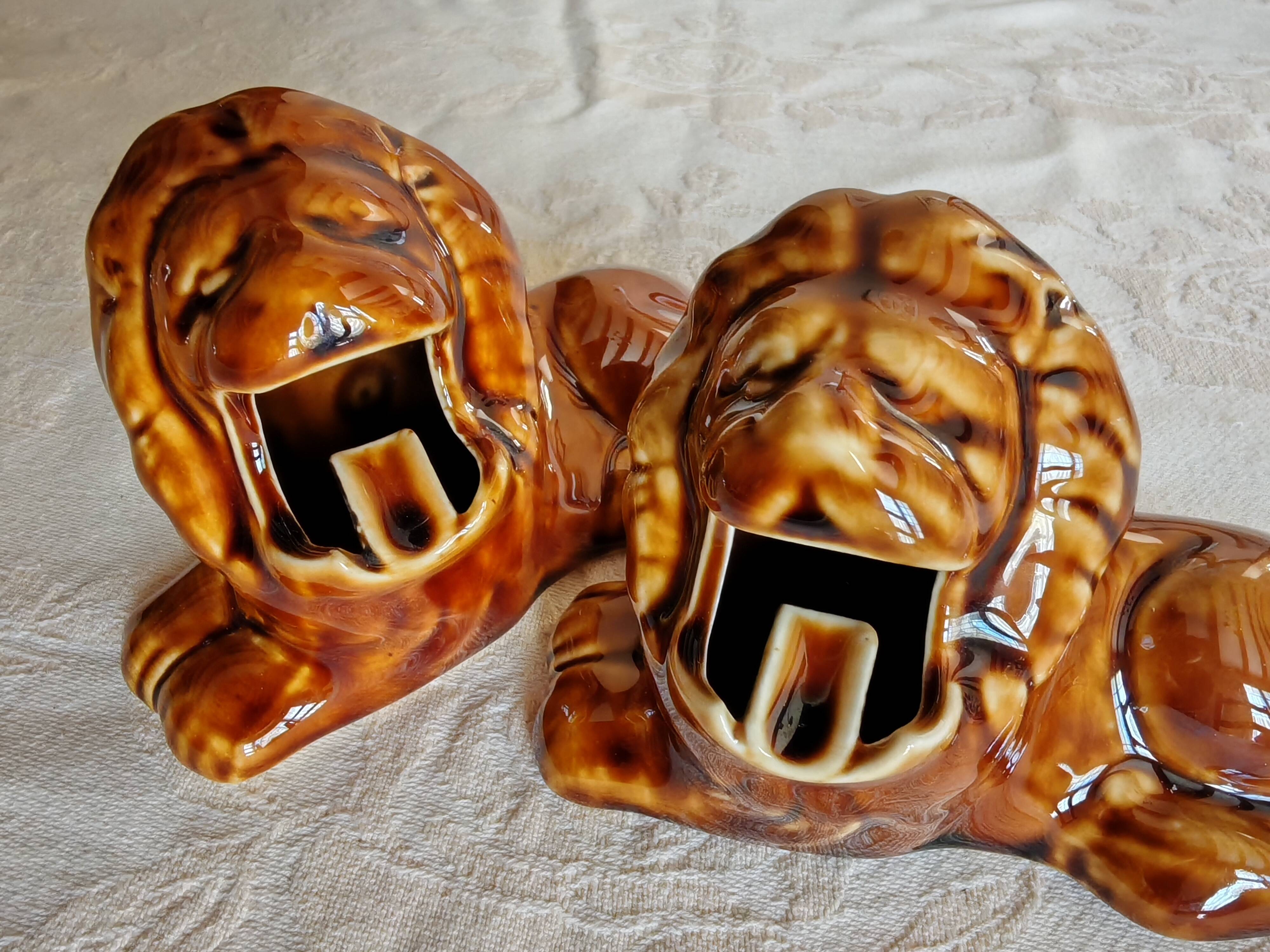Pair of vintage lion ashtrays