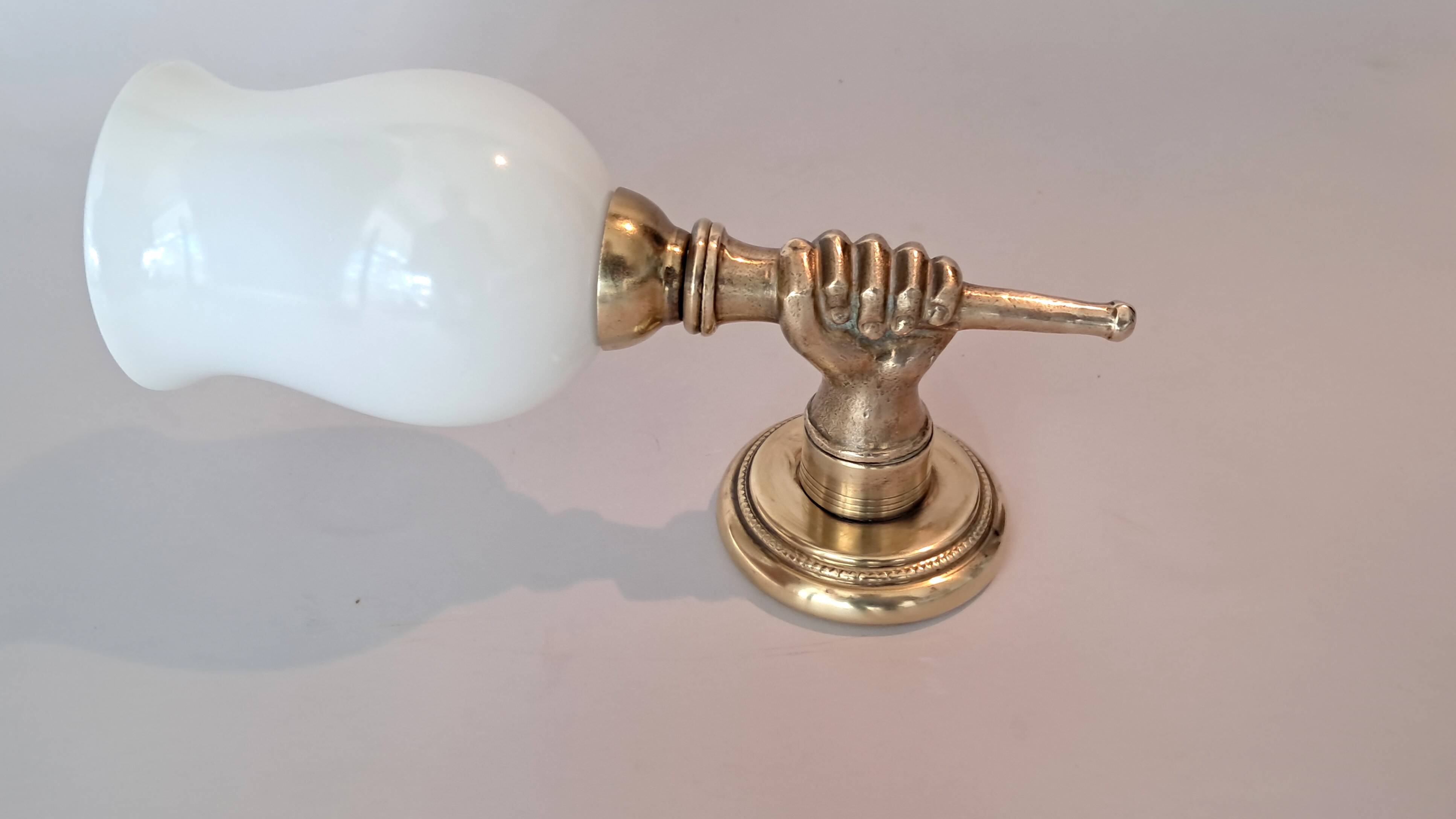 Golden brass wall light from the 1950s.