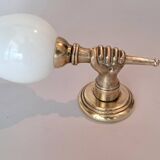 Golden brass wall light from the 1950s.