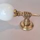 Golden brass wall light from the 1950s.
