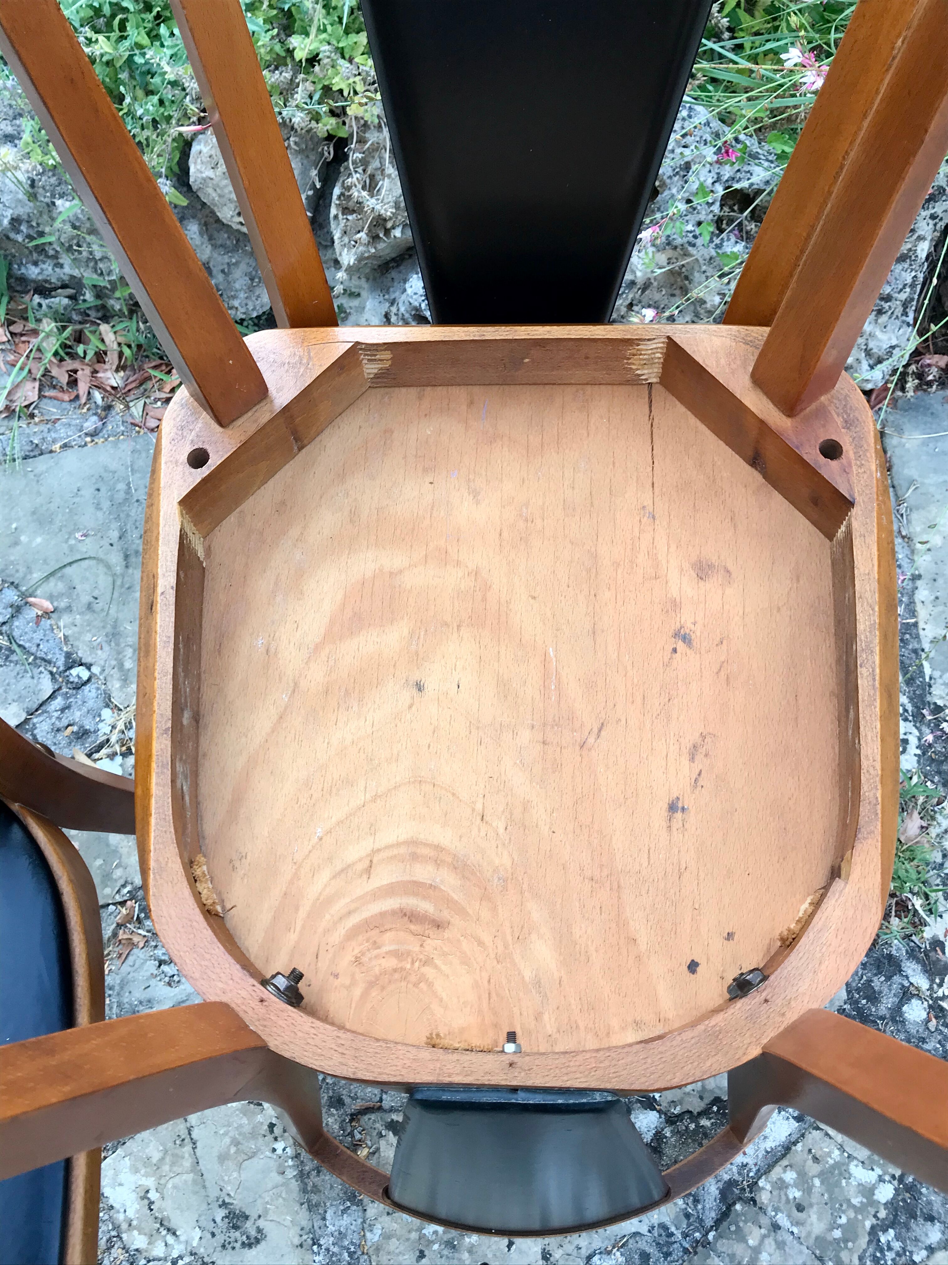 Four vintage beech and skai chairs