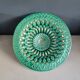 Large pierced earthenware fruit bowl glazed in green and gold.