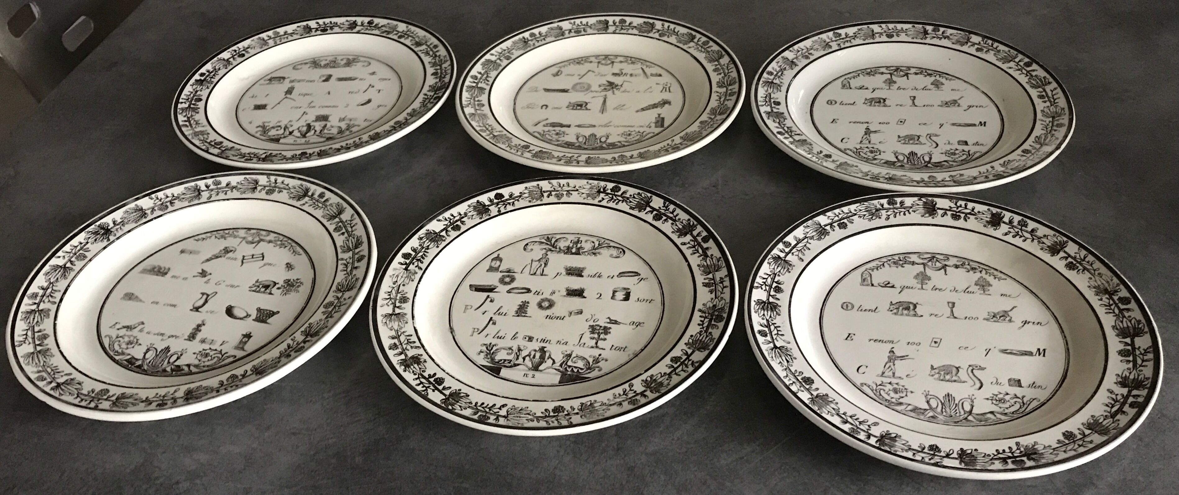 Lot of 6 plates in fine earthenware from choisy-le-roi, p&h, rebus décor; xixth