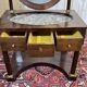 Empire hairdresser from the 19th century in mahogany with a marble top.
