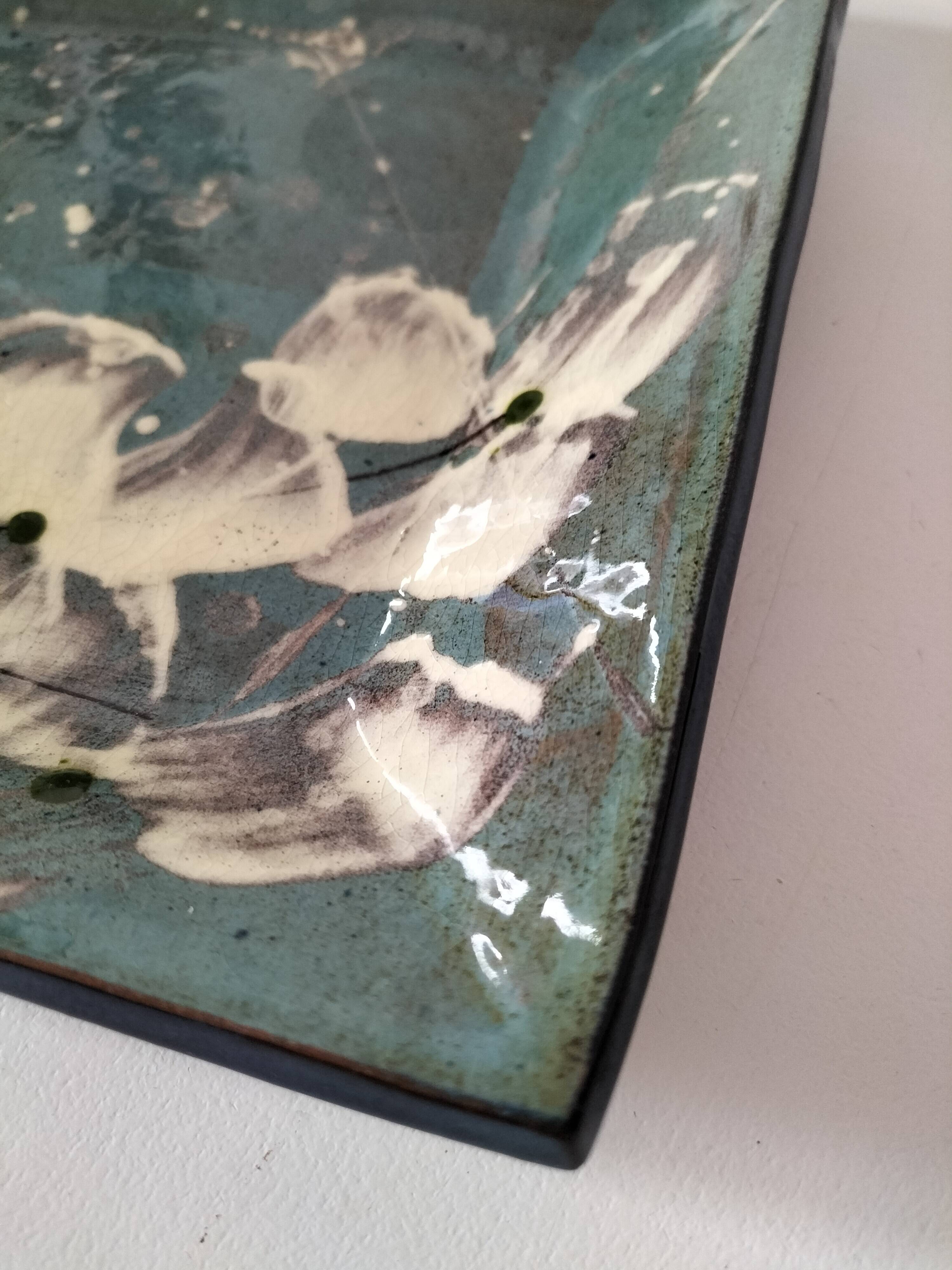 Square turquoise glazed stoneware dish, abstract floral decoration, signed.