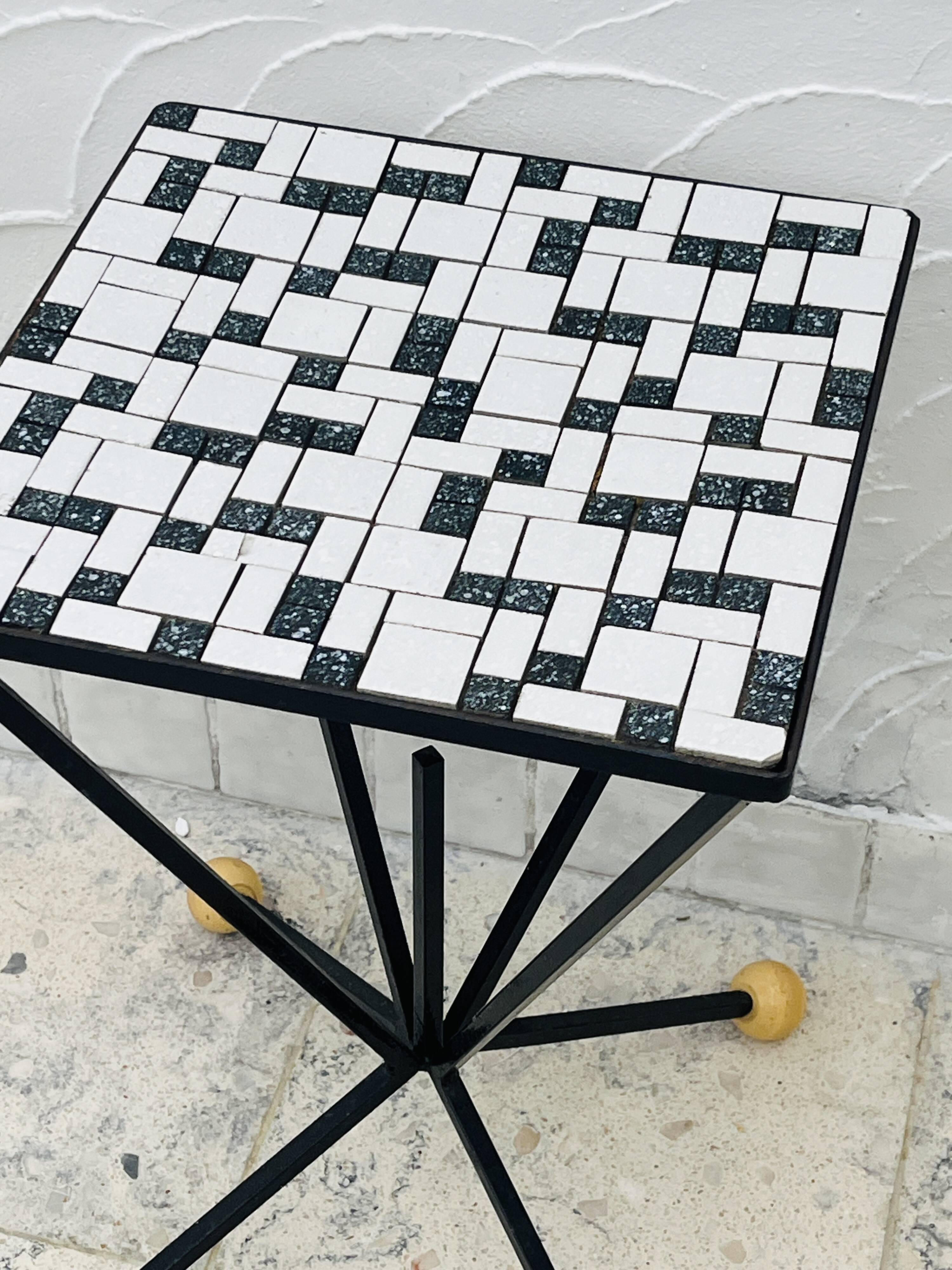 Wrought iron stela and black and white tiled top from the 1960s.