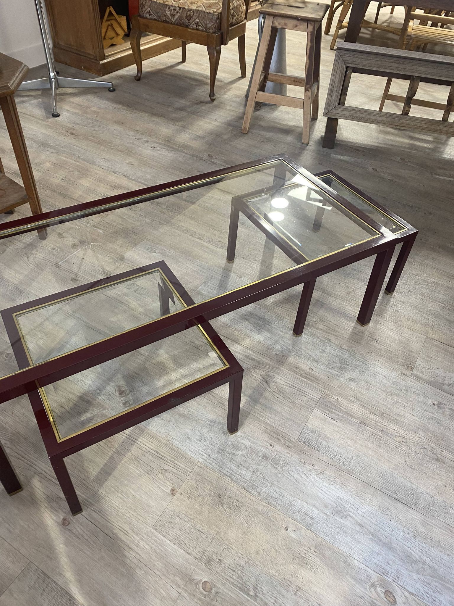 Burgundy lacquered metal, brass and beveled glass nesting tables, France 1950s