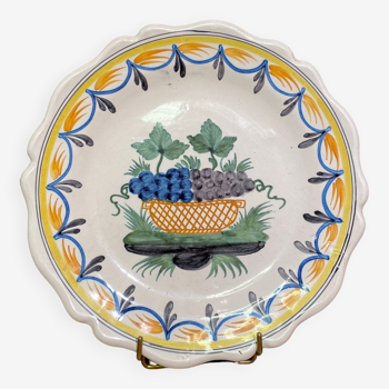 Faience dish of eighteenth-century style nevers decorated with basket with bunches of grapes