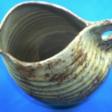 Details on Valauris sandstone pitcher by A.Kostanda, 1950s
