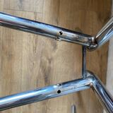 4 chrome chairs with green and white checkered tiles