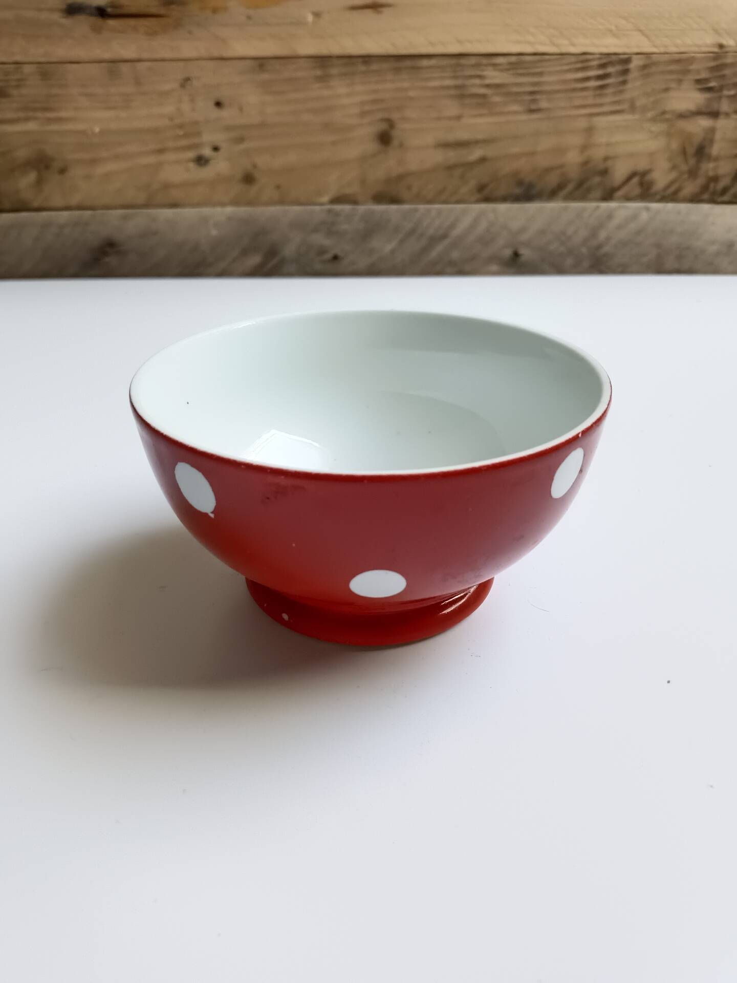 Red bowl with white polka dots in Longchamp ceramic