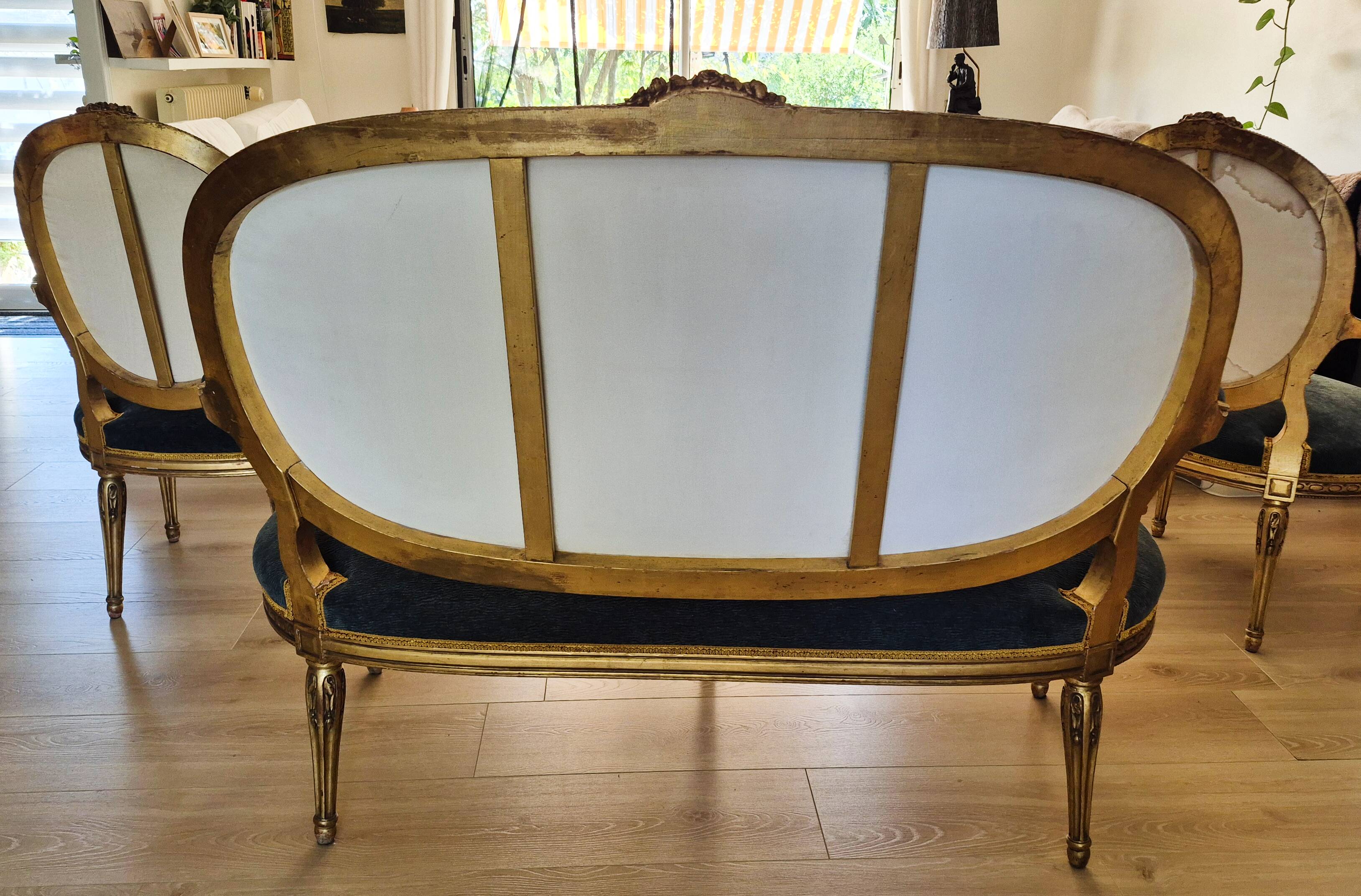 Antique Louis XVI style salon in gilded wood, with medallion backs.