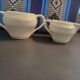 1 milk jug and 1 sugar jar