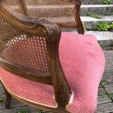 Louis XV style walnut and cane armchair