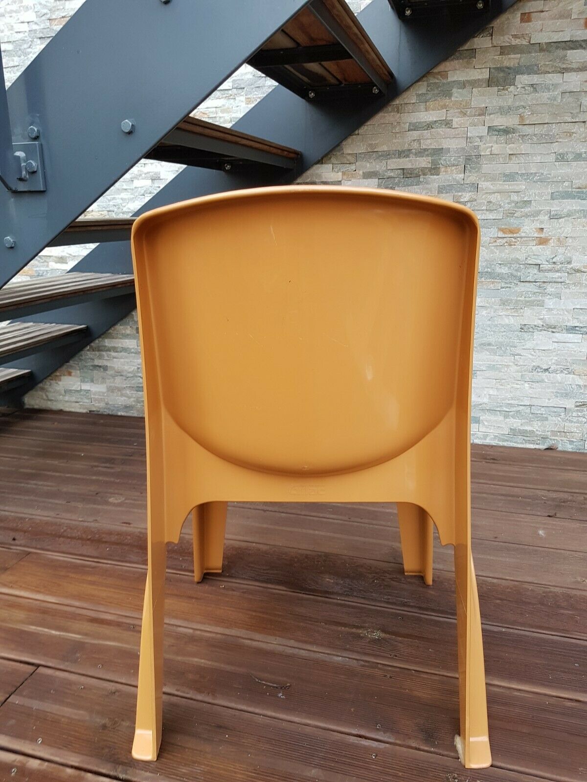 Vintage designer chair in molded plastic