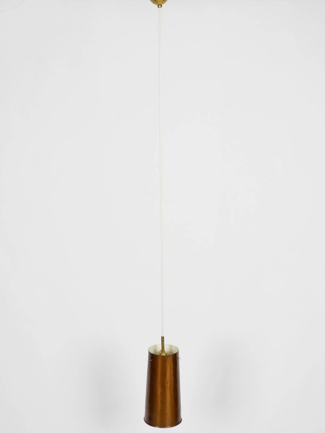 Beautiful Mid Century Modern pendant lamp made of copper shaped like a cone