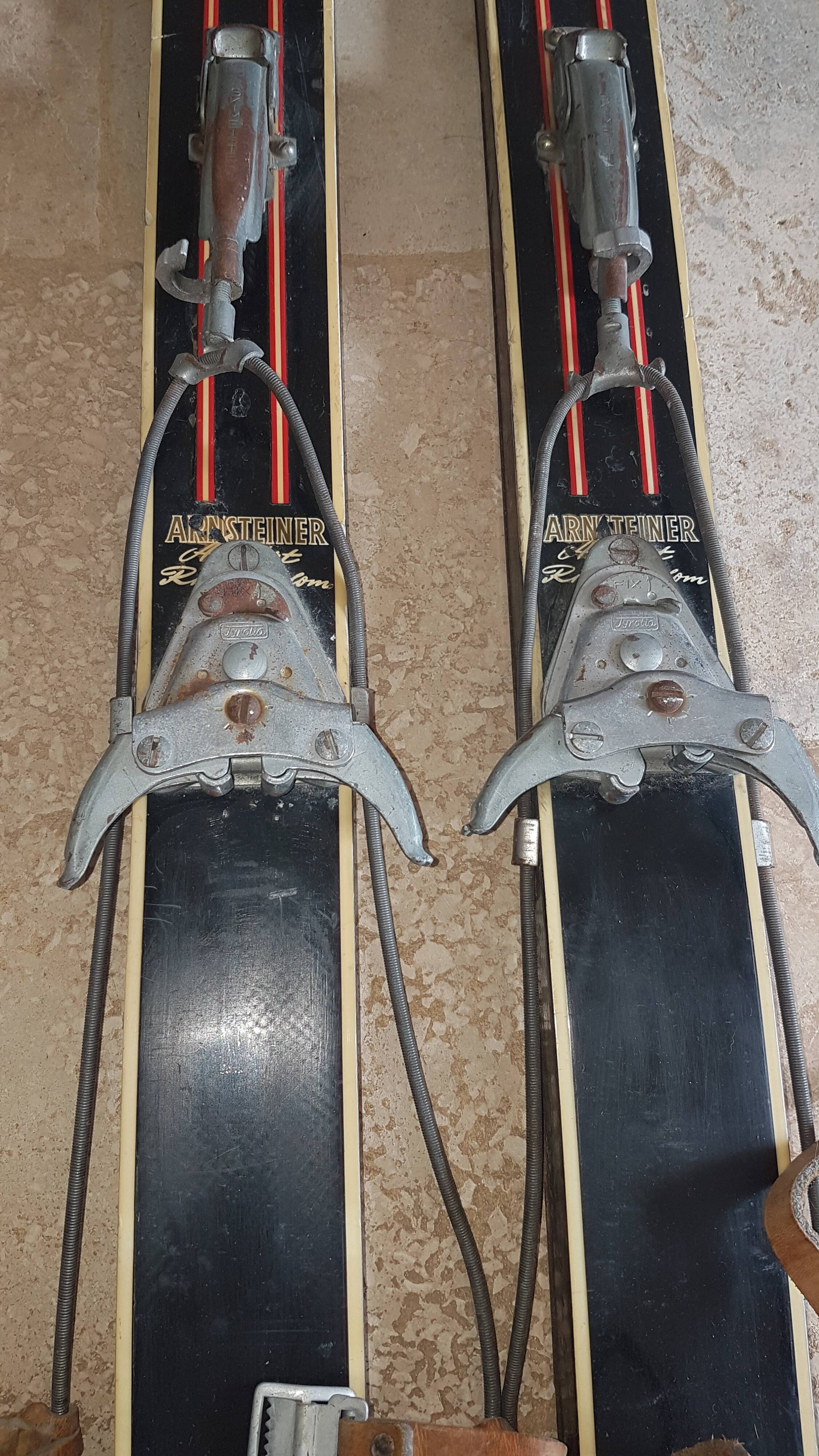 Old skis wooden and its pair of sticks
