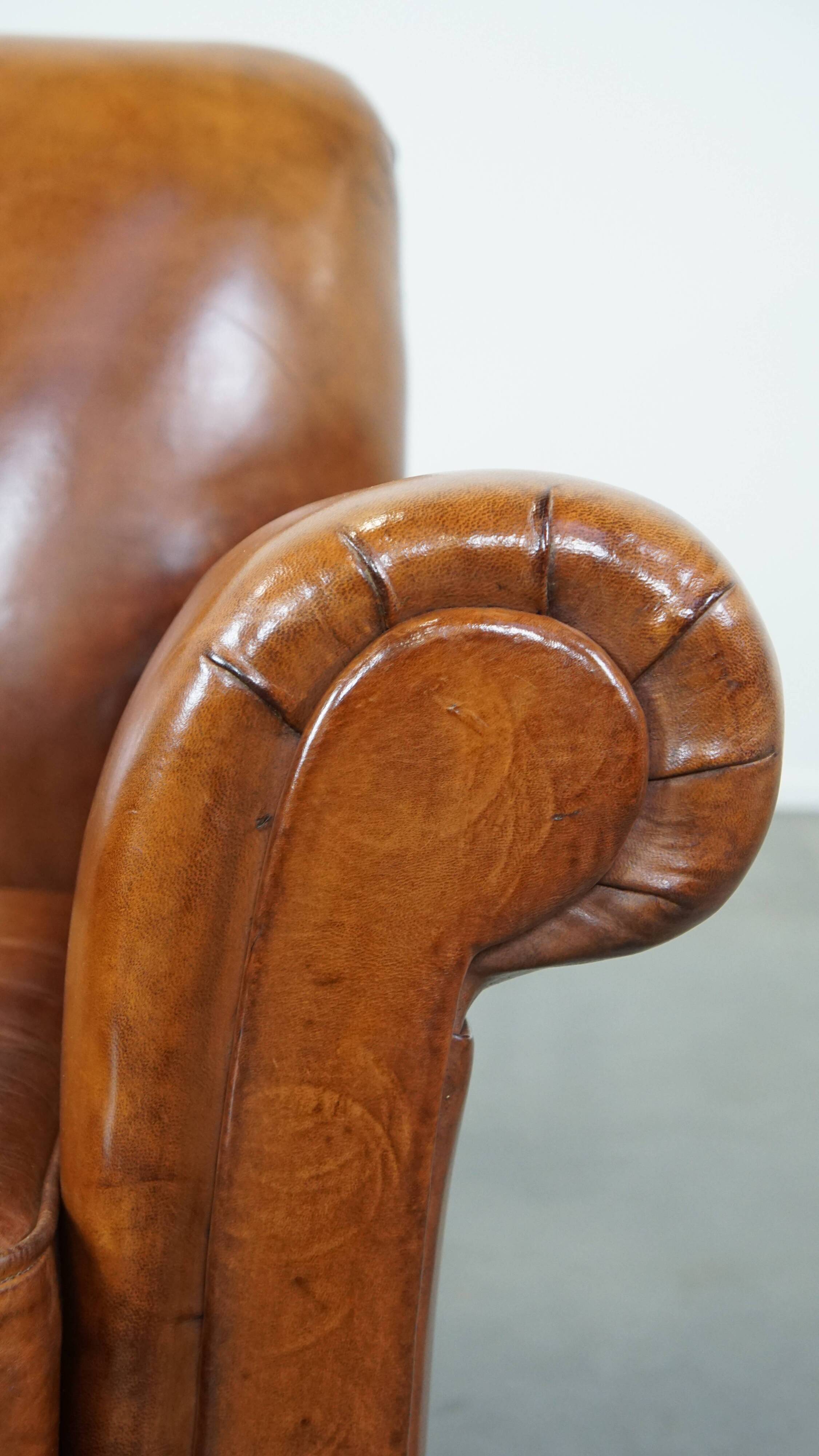 Cognac-colored antique sheep leather armchair